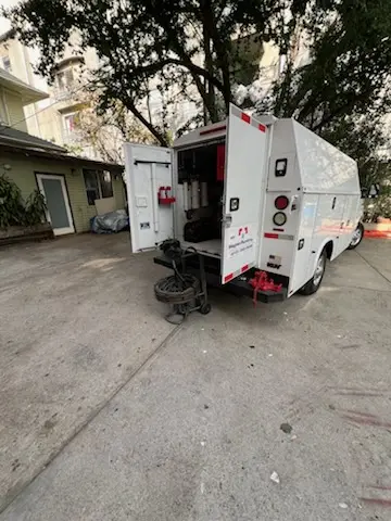 Magnet Plumbing service vehicle on-site for Grease Trap Cleaning in Midway - Am-Cam